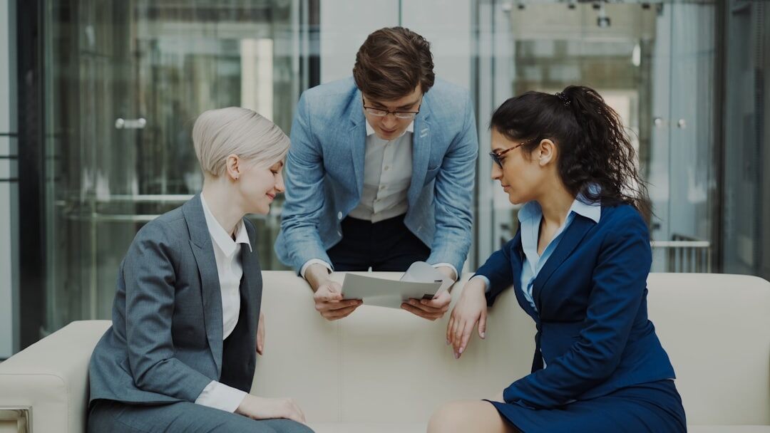 Business team analyzing data on digital screens in modern office