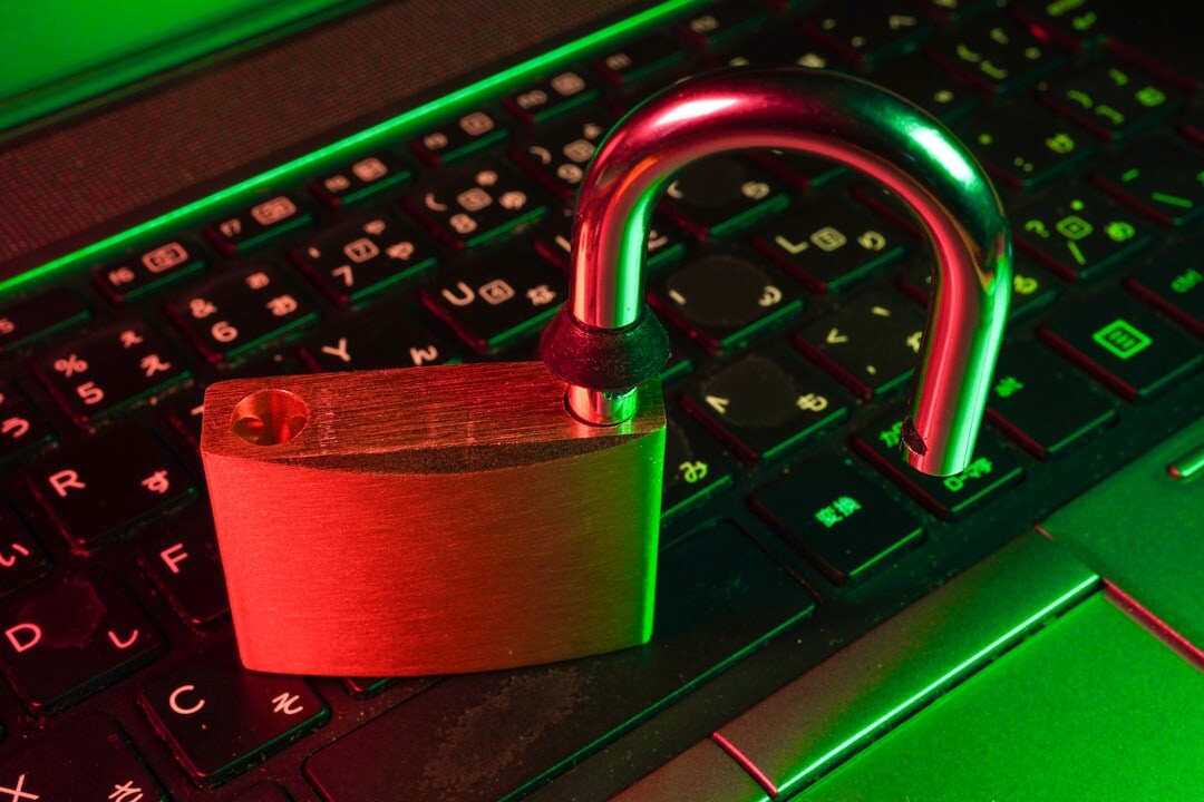 Cybersecurity concept with padlock and digital code streams